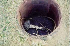 Abandoned well with casing and pump